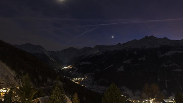 Day to night time lapse of sunset over the Swiss alps, canton of Valais, Switzerland.