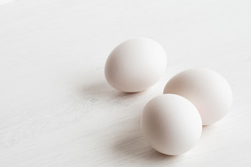 Three whole white eggs.