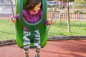 Little girl posing in park