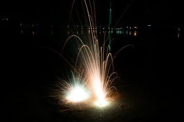 Playing with New Year firecrackers at night, dark background - 1/1/2020