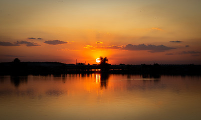 Fototapeta na wymiar Lacul Morii, Bucharest, Romania - A beautiful sunset over the lake in high contrast