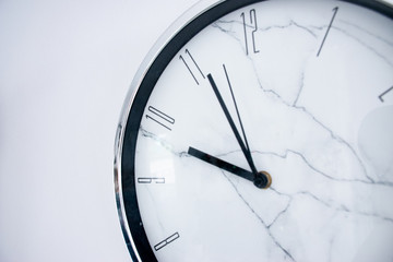  Marble wall clock hanging on white wall