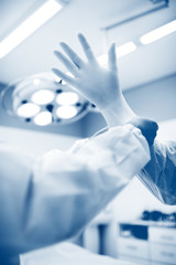 surgeon's hands in gloves closeup. Surgeons team preparing for a complex operation.