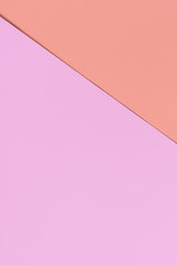 Lilac and soft pastel terracotta colored paper for the background. Geometric paper background of two tones.