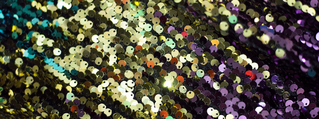 Banner festive background of beautiful multi-colored sequins.