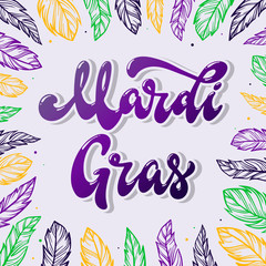 Obraz premium Mardi Gras hand lettering quote decorated with feathers on light grey background