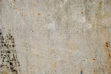 Smooth concrete wall with cracks and mold marks.