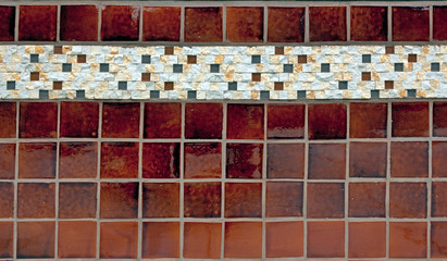 Vintage tile knee wall on exterior of old store.