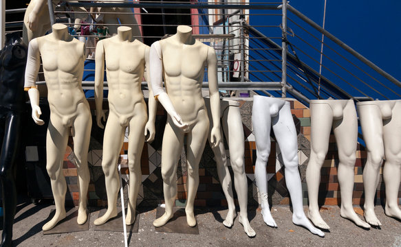 Row of naked male mannequins for sale. 