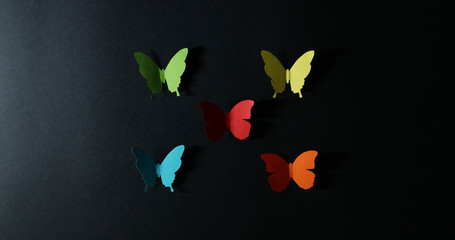 paper butterflies on a dark background