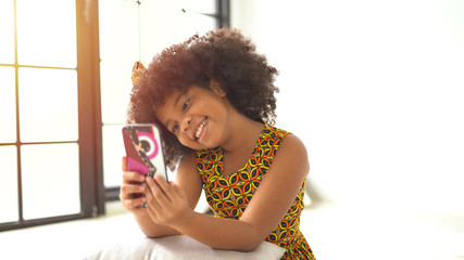 African american girl making a selfie on a mobile phone.