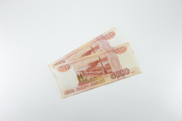Russian currency. Two old five thousandth bills on a white background.