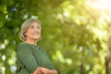 Happy senior beautiful woman in spring park © aletia2011
