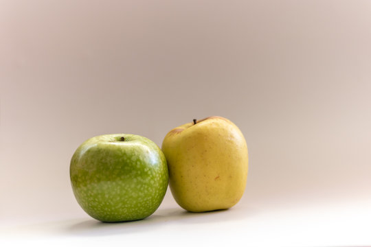 Fresh green apples of two kinds: golden and granny