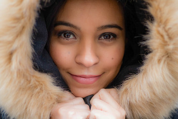 Winter smiling girl in head fur
