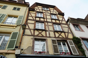 Fototapeta na wymiar Facade or façade of a historical house in typical architecture style in Alsace, Colmar, France. 