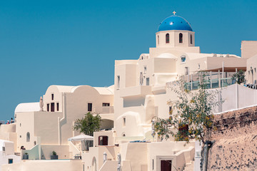 Naklejka premium Classical view on the decoration and architecture of Oia village Santorini at sun weather