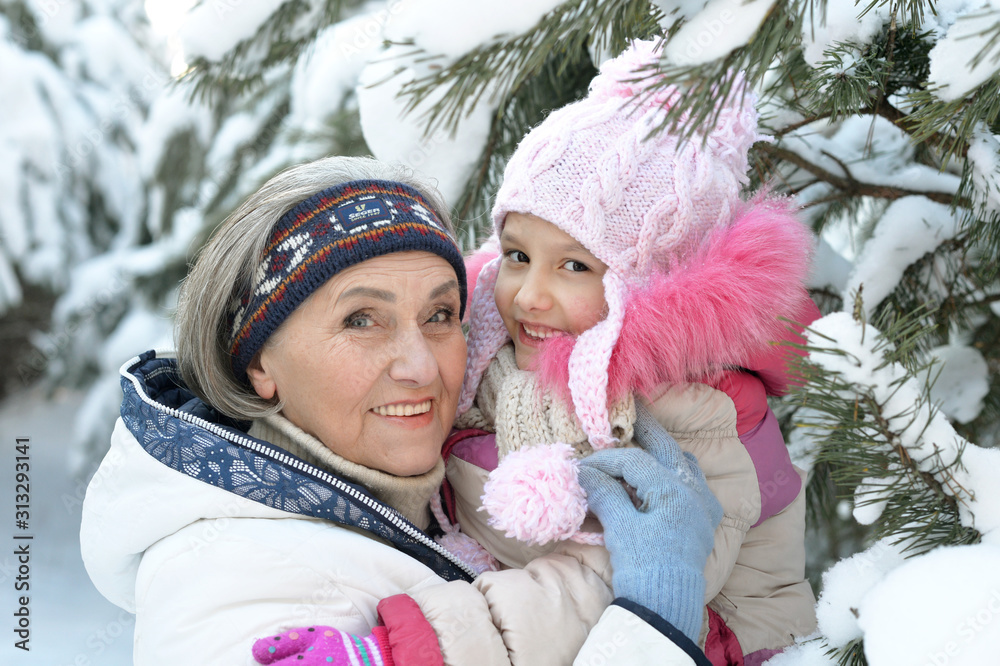 Canvas Prints Close up portrait of grandmother and granddaughter in winter