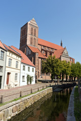 Naklejka premium Muehlengrube River with St. Nicholas Church, Wismar, Mecklenburg-Western Pomerania, Germany