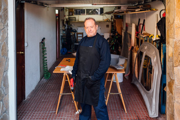 62 year old man working at the fiber workshop