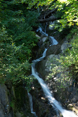 Fototapeta na wymiar Kleiner Wasserfall im Kleinwalsertal