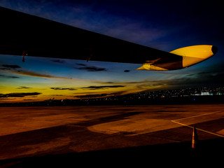 Fototapeta na wymiar Views out the aircraft window sunset clouds beach ocean