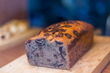 A chocolate cake with banana on a table