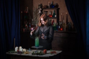 young witch in home. Halloween concept