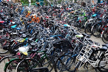 Hundreds of parked bicycles at the bike parking place in Netherlands