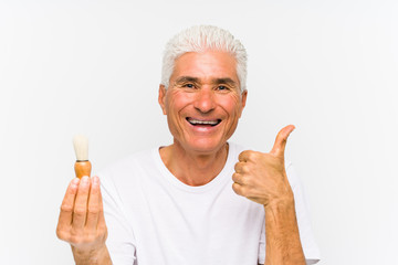 Senior caucasian man recently shaved smiling and raising thumb up