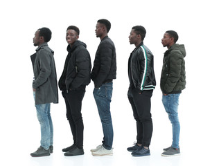 Obraz premium group of diverse guys standing in turns . isolated on white