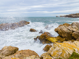 Waves breaking against the rocky coast