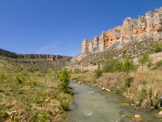 River and limestone cliff