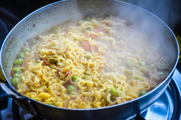 Maggie with tomato sauce and vegetable