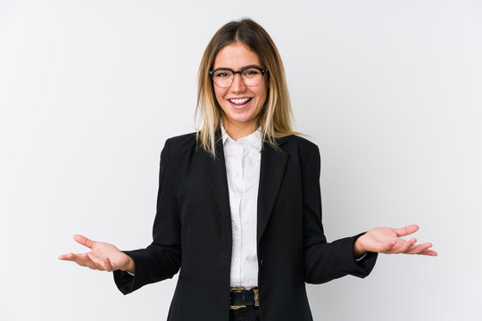 Young business caucasian woman showing a welcome expression.