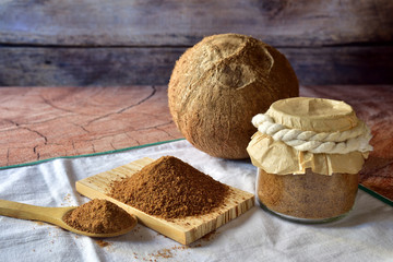 Integral natural coconut sugar. Extracted and ground in handmade process. Rustic background and ambience. Space to write, natural lighting. 