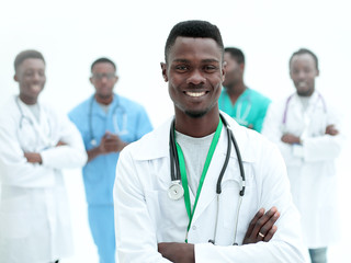 young confident doctor on the background of his colleagues