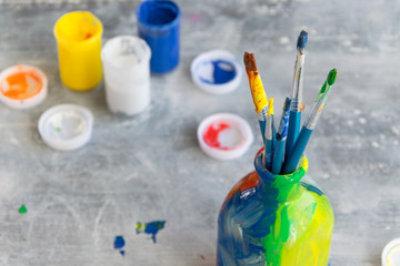 Paint brushes on grey background, artistic craft concept, space for text