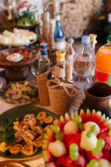 bottle of alcohol tied with string, the decor is festive Banquet table