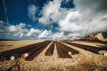metal reinforcement lies on the ground in front of the builder