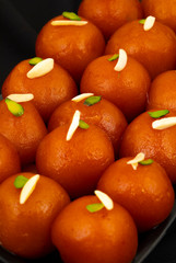 Indian Popular Dessert Gulab Jamun Also know as kala Jamun or Kalajam is a Soft Delicious Berry Sized Balls Made of Milk Solids