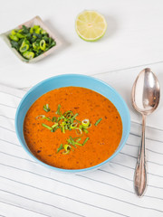 Fresh tomato soup with lemon and spring onions