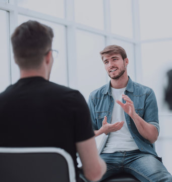 two young men talking in the TV Studio