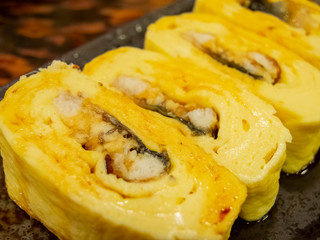 Close up shot of an egg and eel roll
