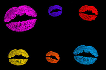 Fototapeta na wymiar Lips and kiss. Print of multi-colored lipstick. Traces of lipstick and kisses, copy space.