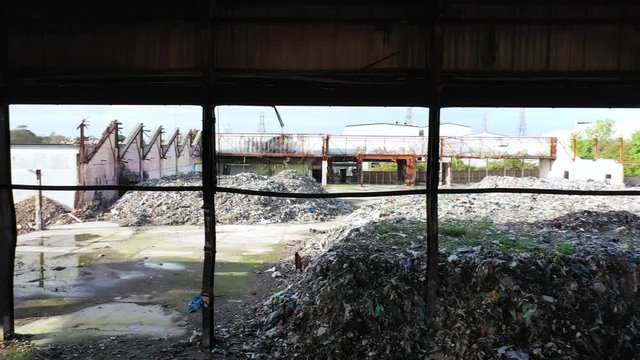 Aerial view of a warehouse destroyed by fire and filled with waste junk, Margate, Kent, UK