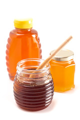 Jars of Raw Natural Honey on a White Background