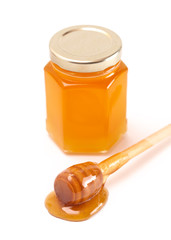 Jar of Raw Natural Honey Isolated on a White Background
