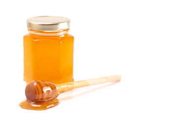 Jar of Raw Natural Honey Isolated on a White Background