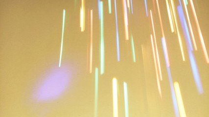 Holiday background or greeting card. Sun glare on a yellow background. The nuances of orange,...